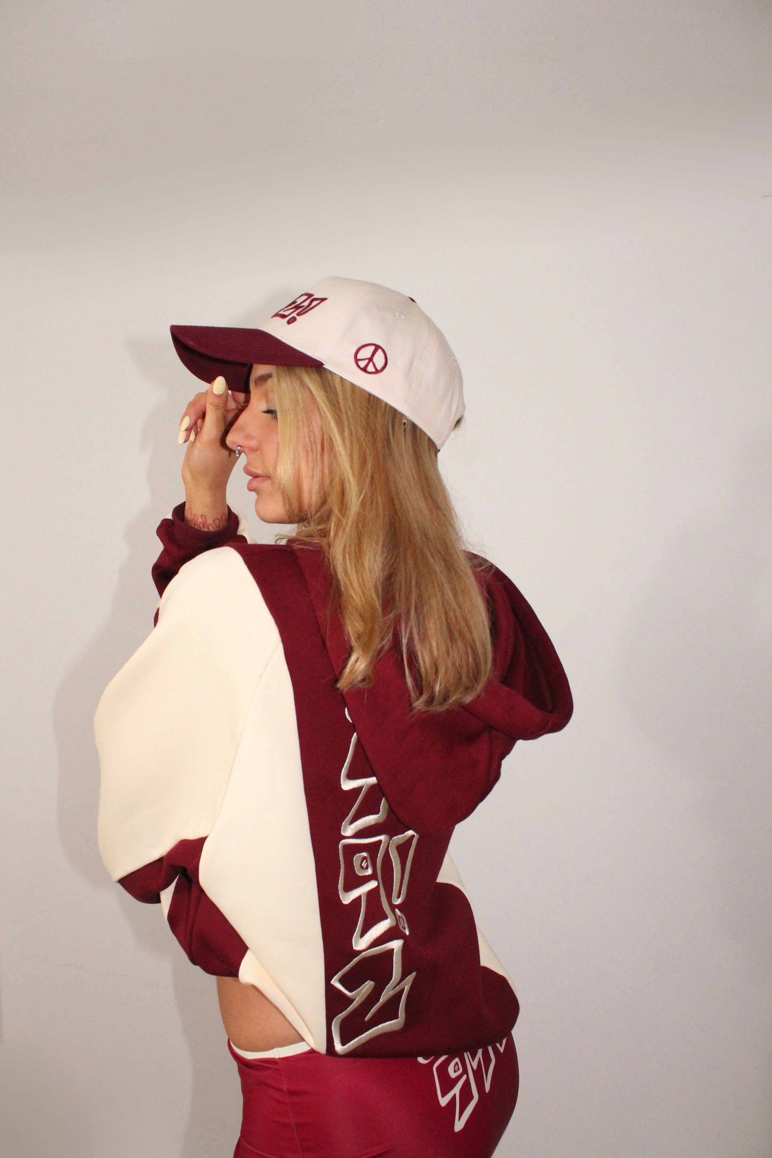 baseball cap in burgundy and cream