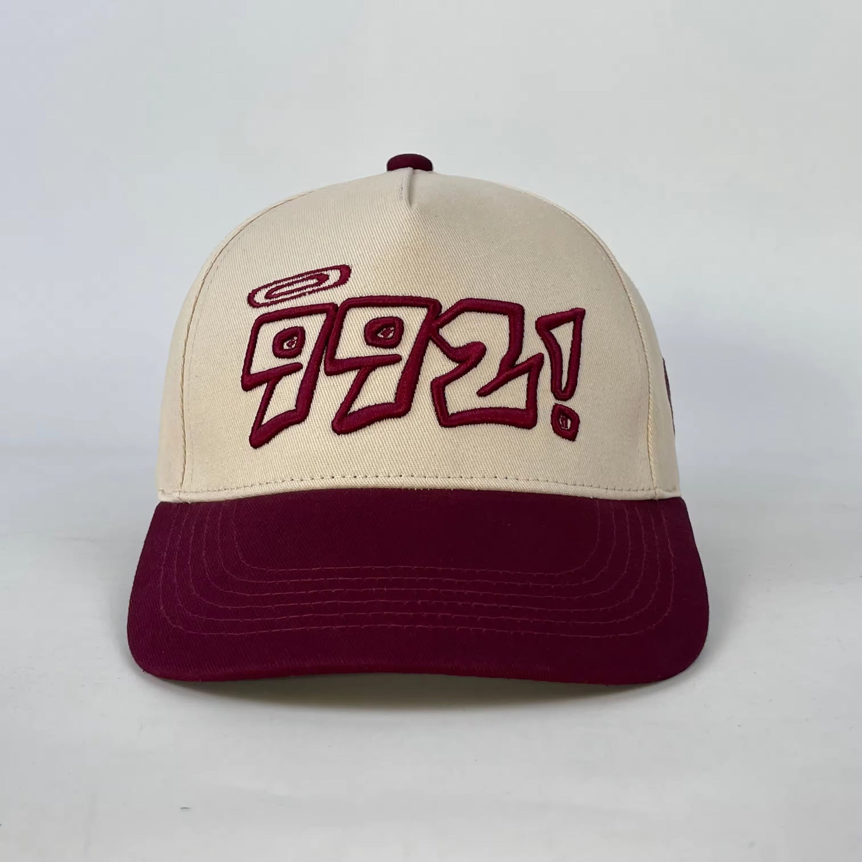 baseball cap in burgundy and cream