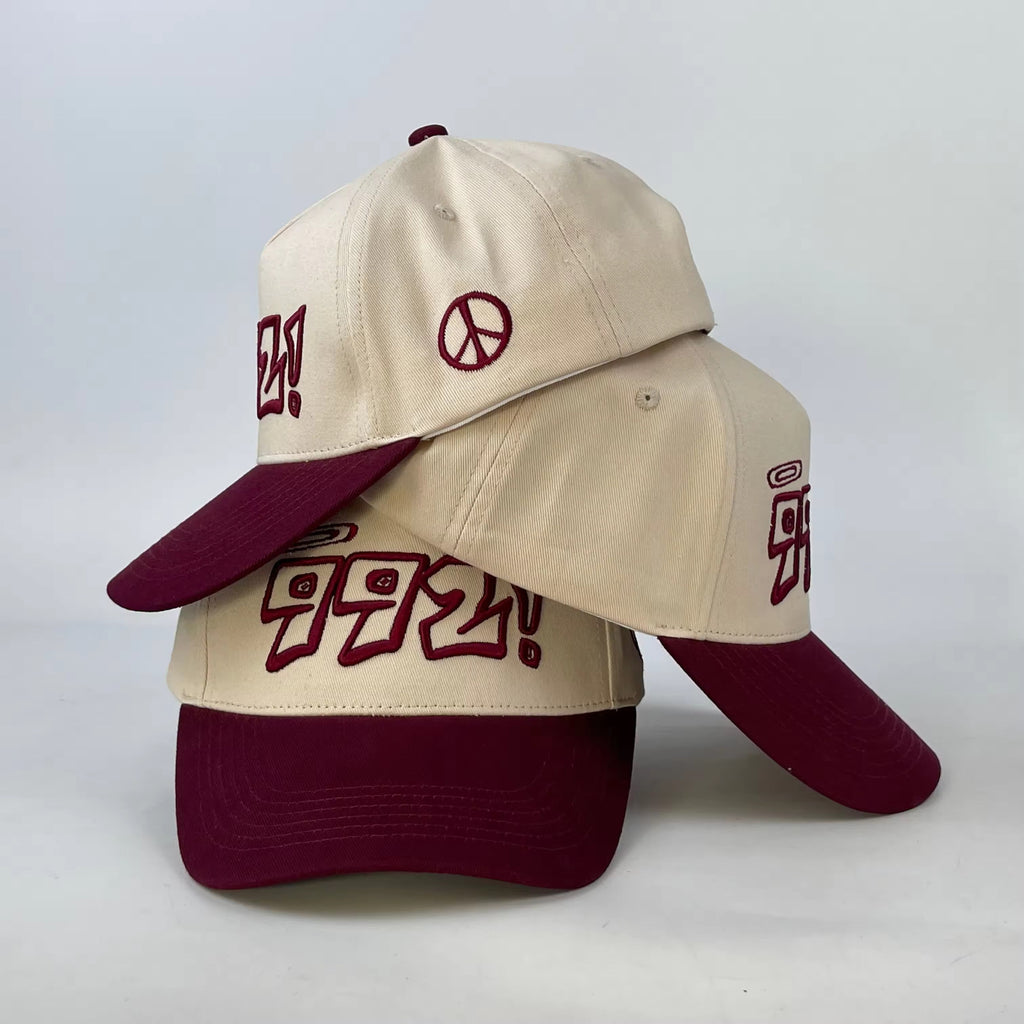 baseball cap in burgundy and cream