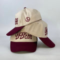 baseball cap in burgundy and cream