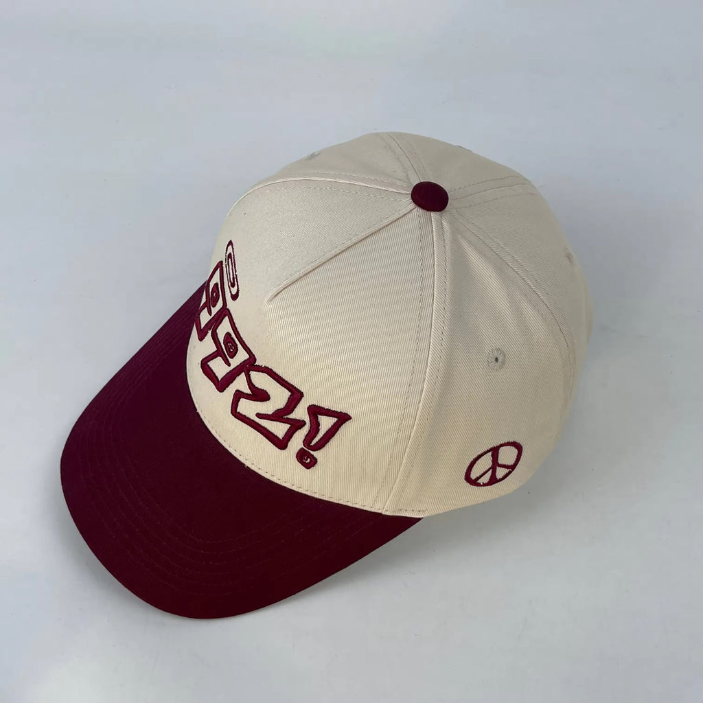 baseball cap in burgundy and cream